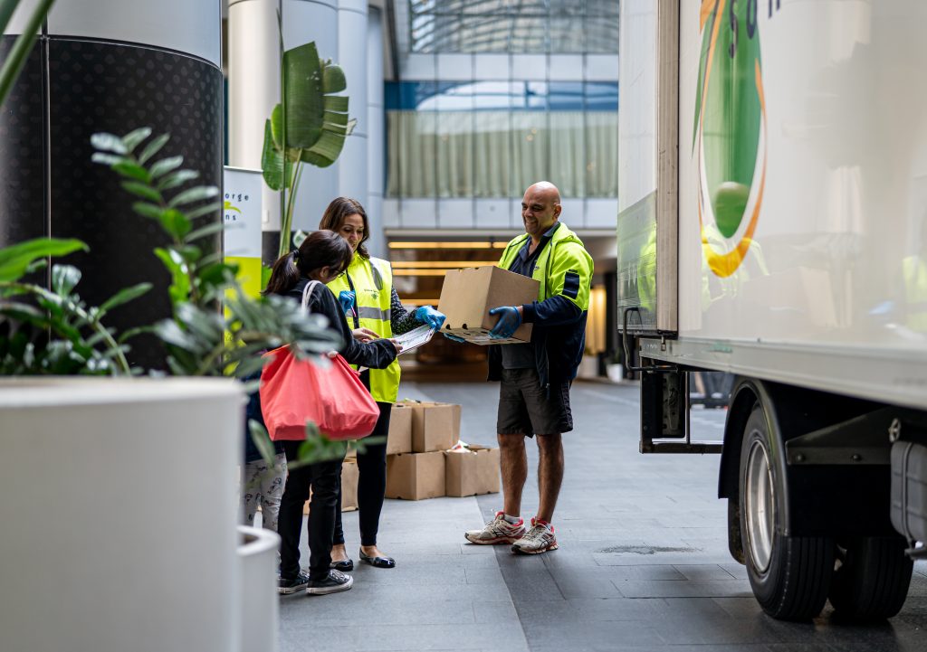 A Simon George & Son driver delivers a care package