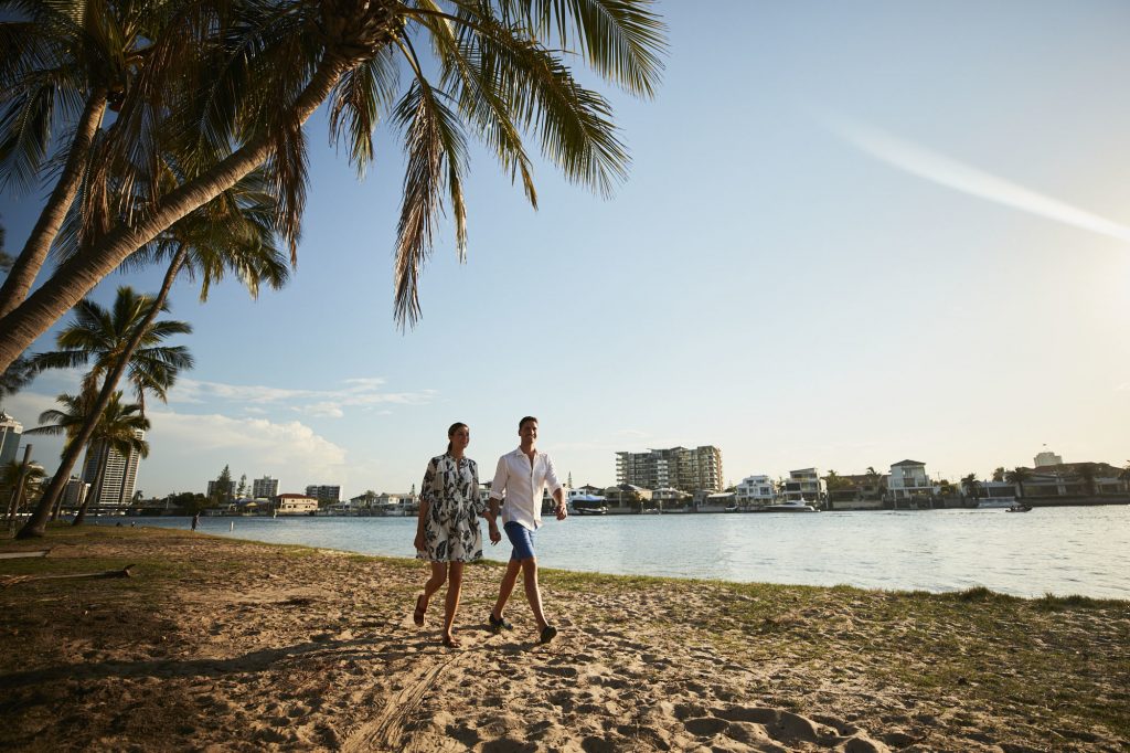 Couple walking on Budds Beach