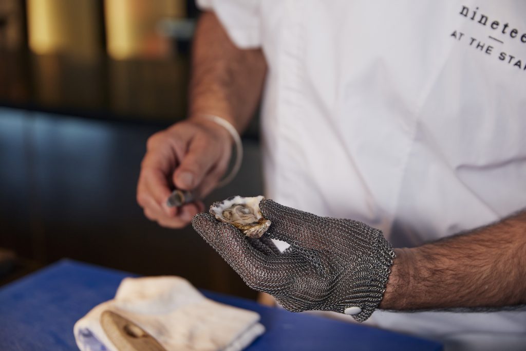 Chef Uday Huja preparing an oyster
