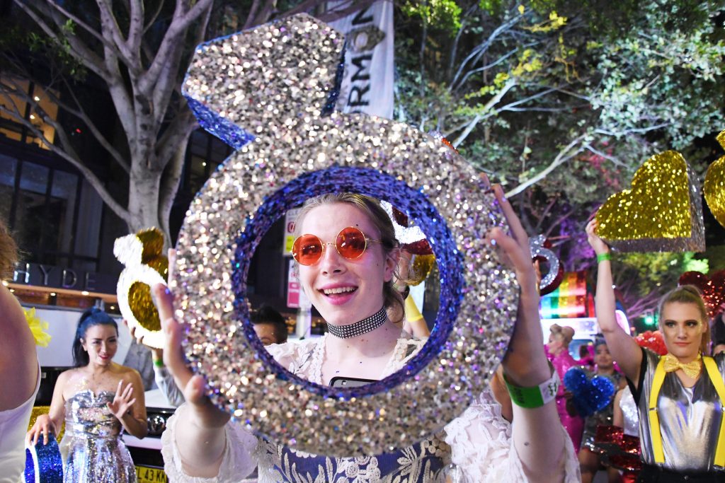 A team member from The Star holds a ring at the 2018 Mardi Gras parade