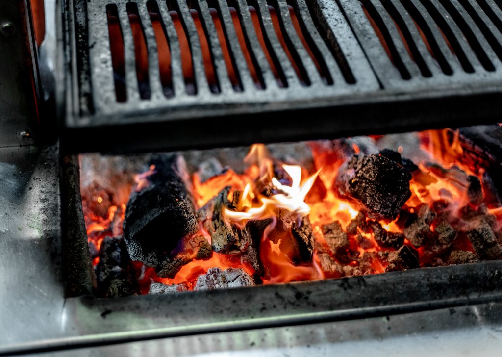 A wood-fired barbecue grill